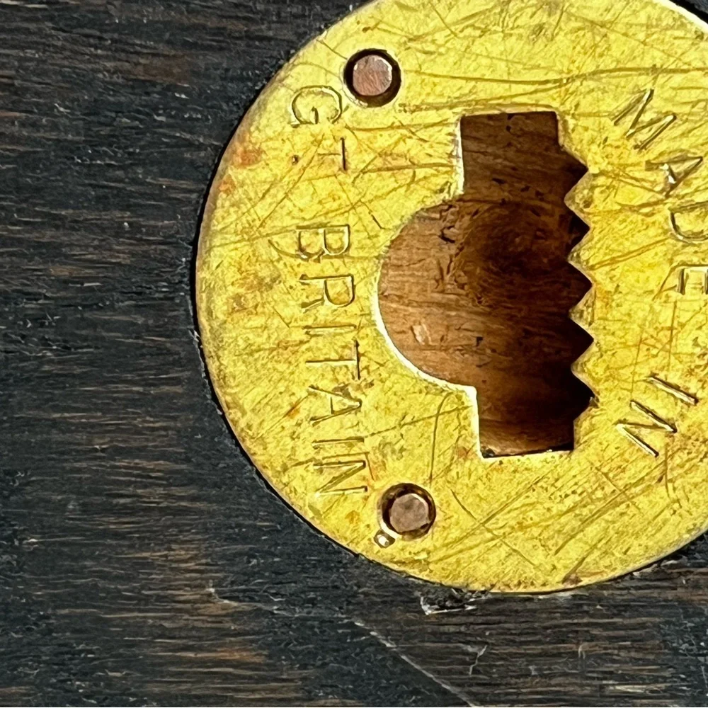 wooden plaques featuring family crests or coats of arms. McBrayer and Fllington.